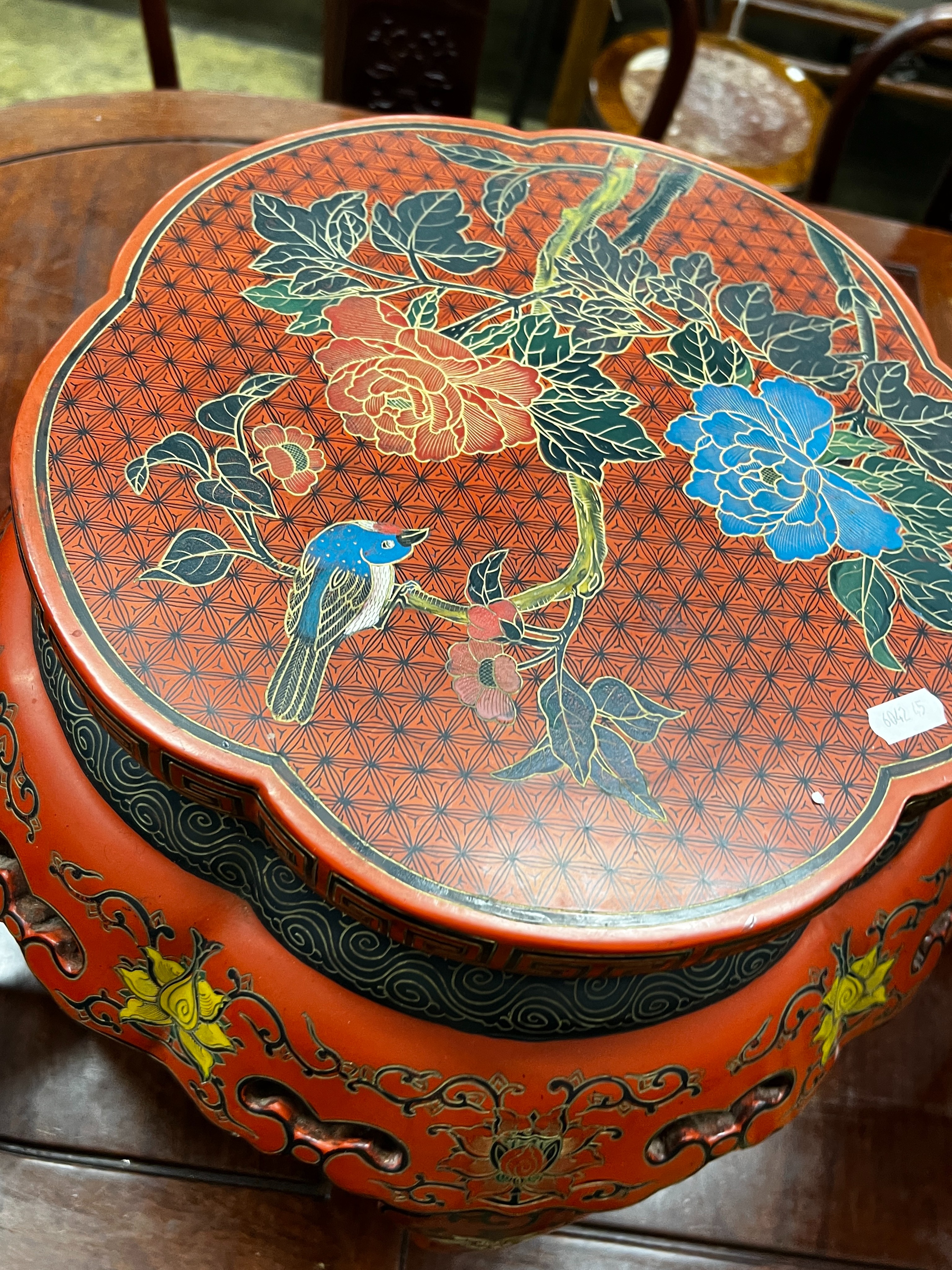 A Chinese red lacquer circular vase stand, diameter 44cm, height 47cm together with a similar Chinese red painted parcelgilt lantern, height 41cm